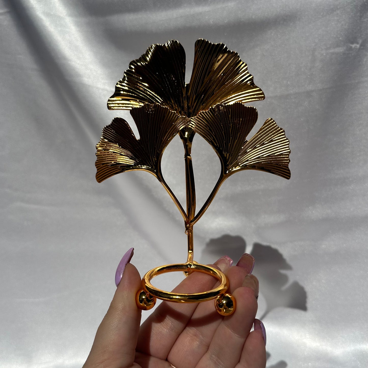 Gold fan leaf sphere stand