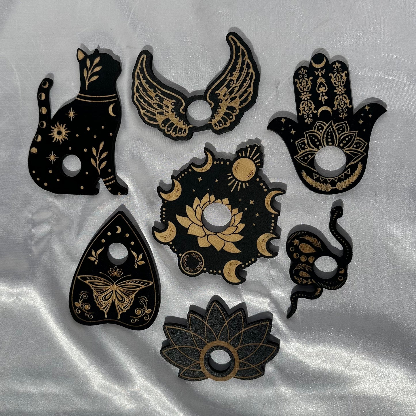Assorted black wood sphere stands