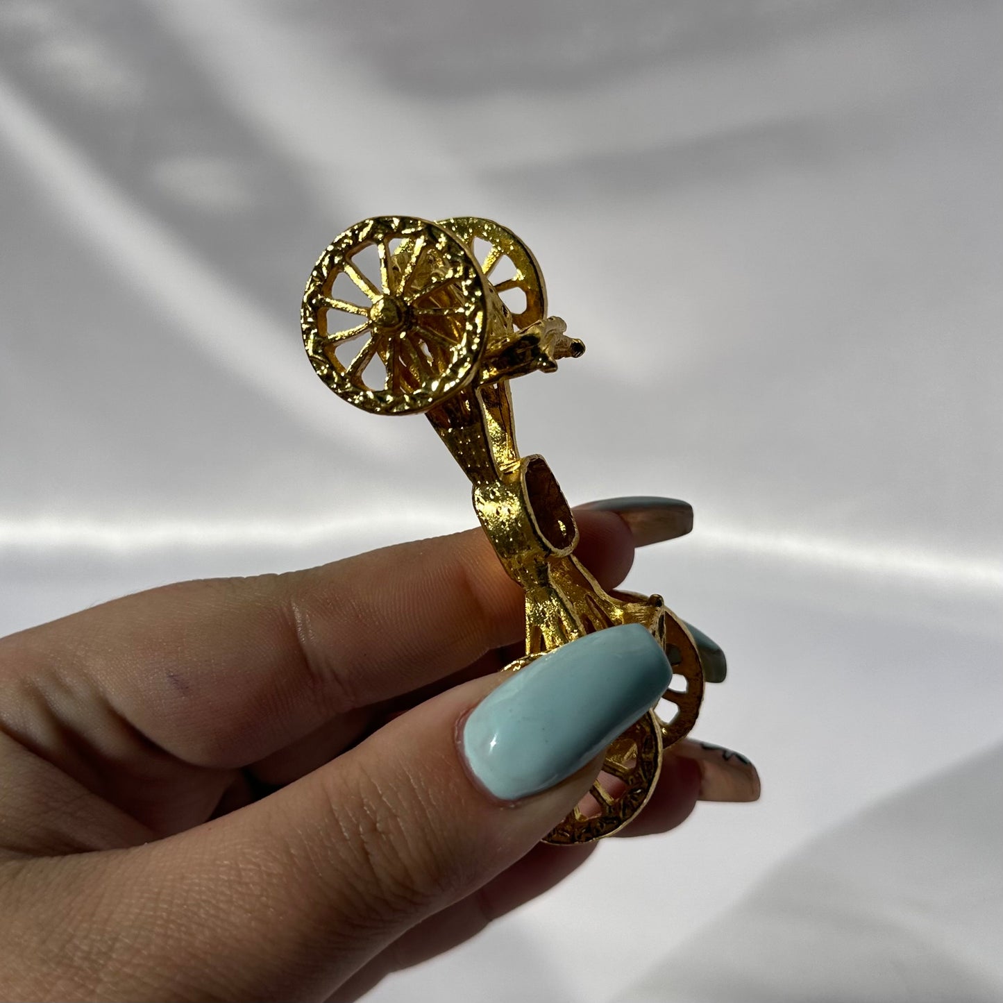 Gold carriage sphere stand