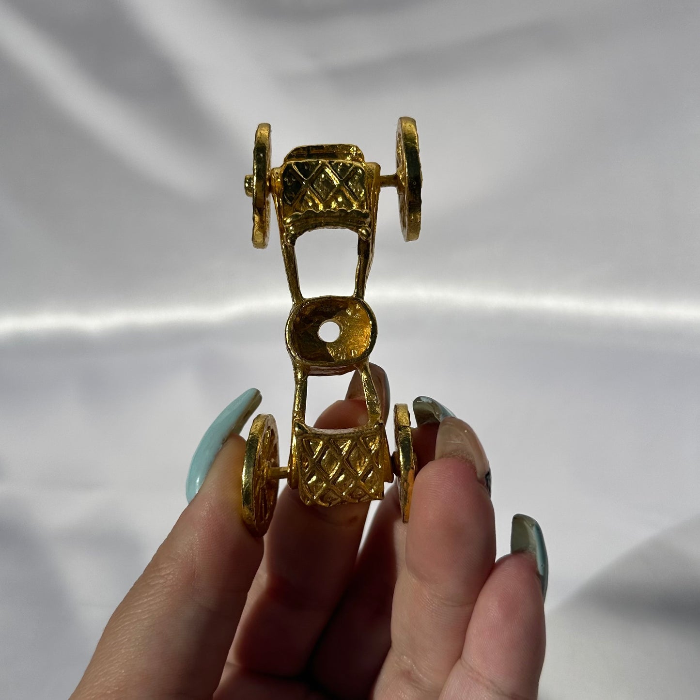 Gold carriage sphere stand