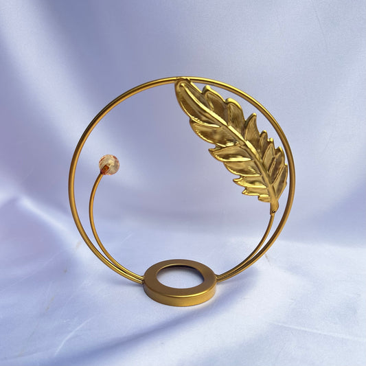 Gold leaf in flight sphere display stand