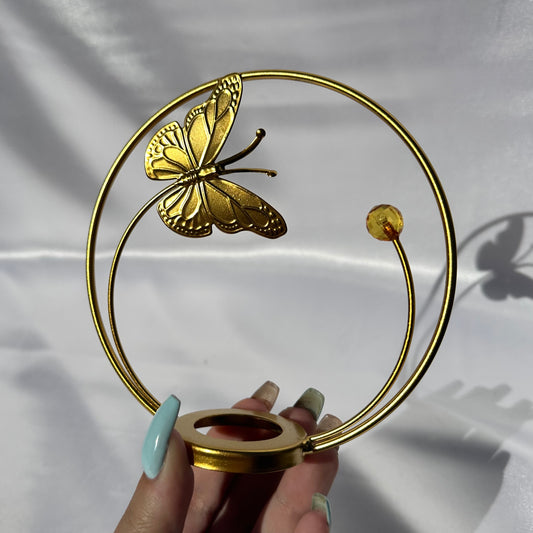 Gold butterfly in flight sphere display stand