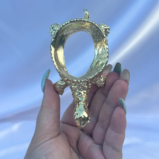 Gold metal turtle sphere stand