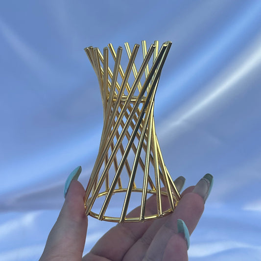 Gold twirl sphere stand