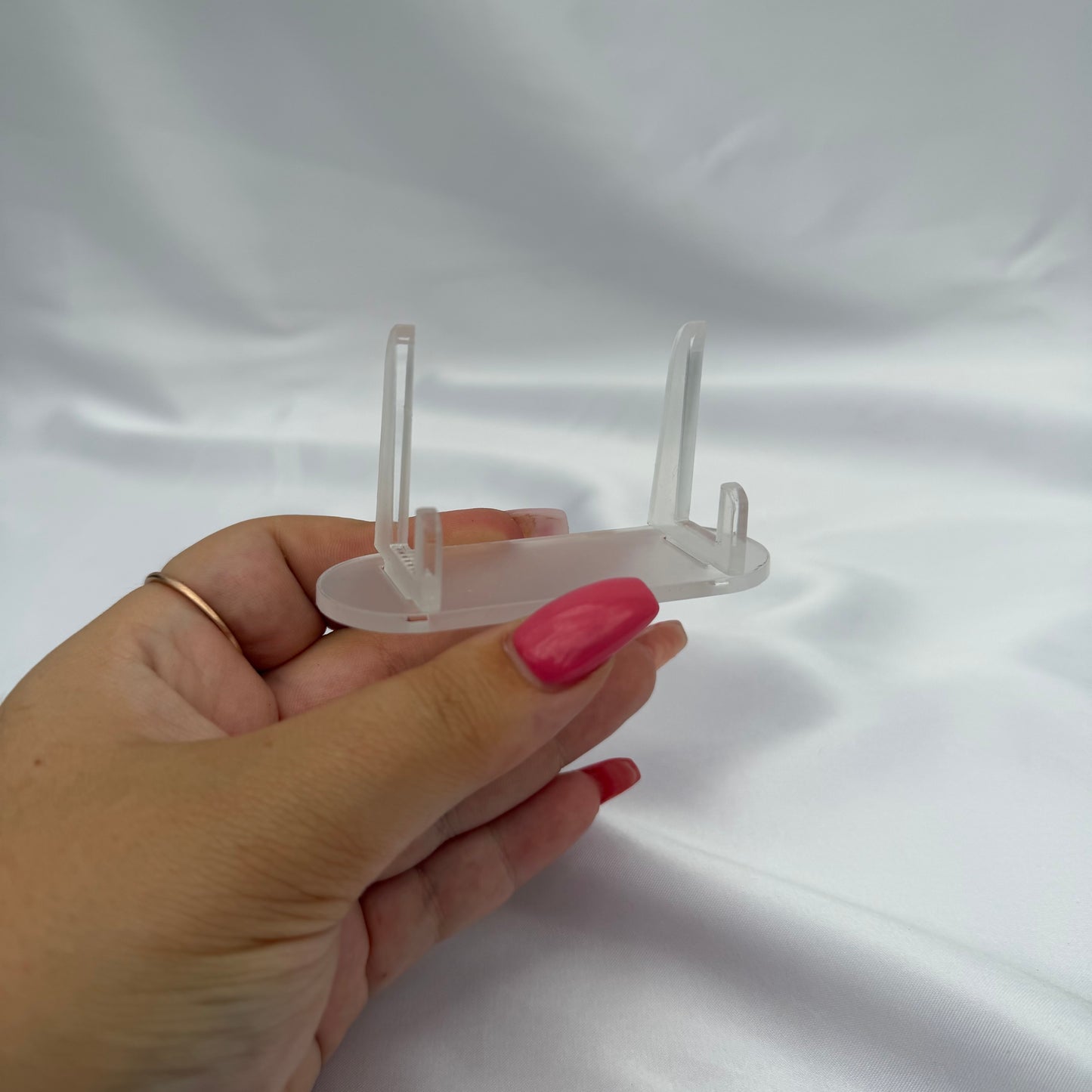 Clear plastic slot display stand